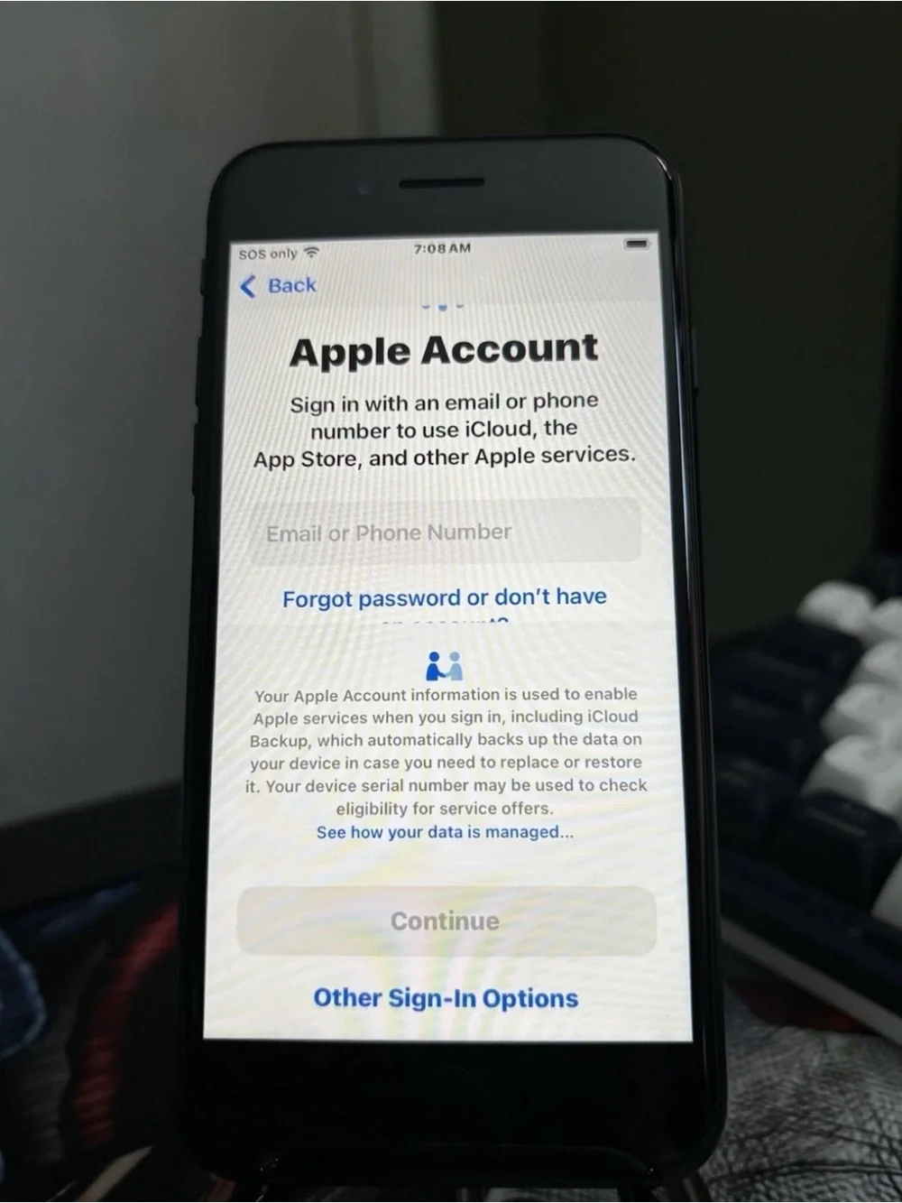 Apple iPhone SE 3 in Midnight Black with 64GB storage and iOS 18.3.2